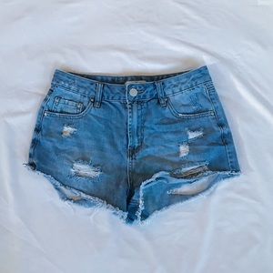 Ripped medium blue shorts